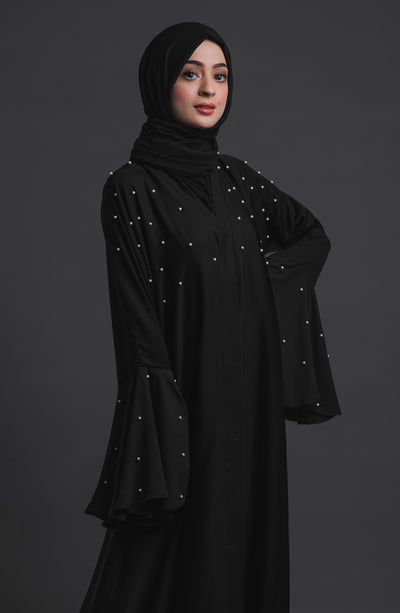 black abaya with pearl embellishment on sleeves and chest