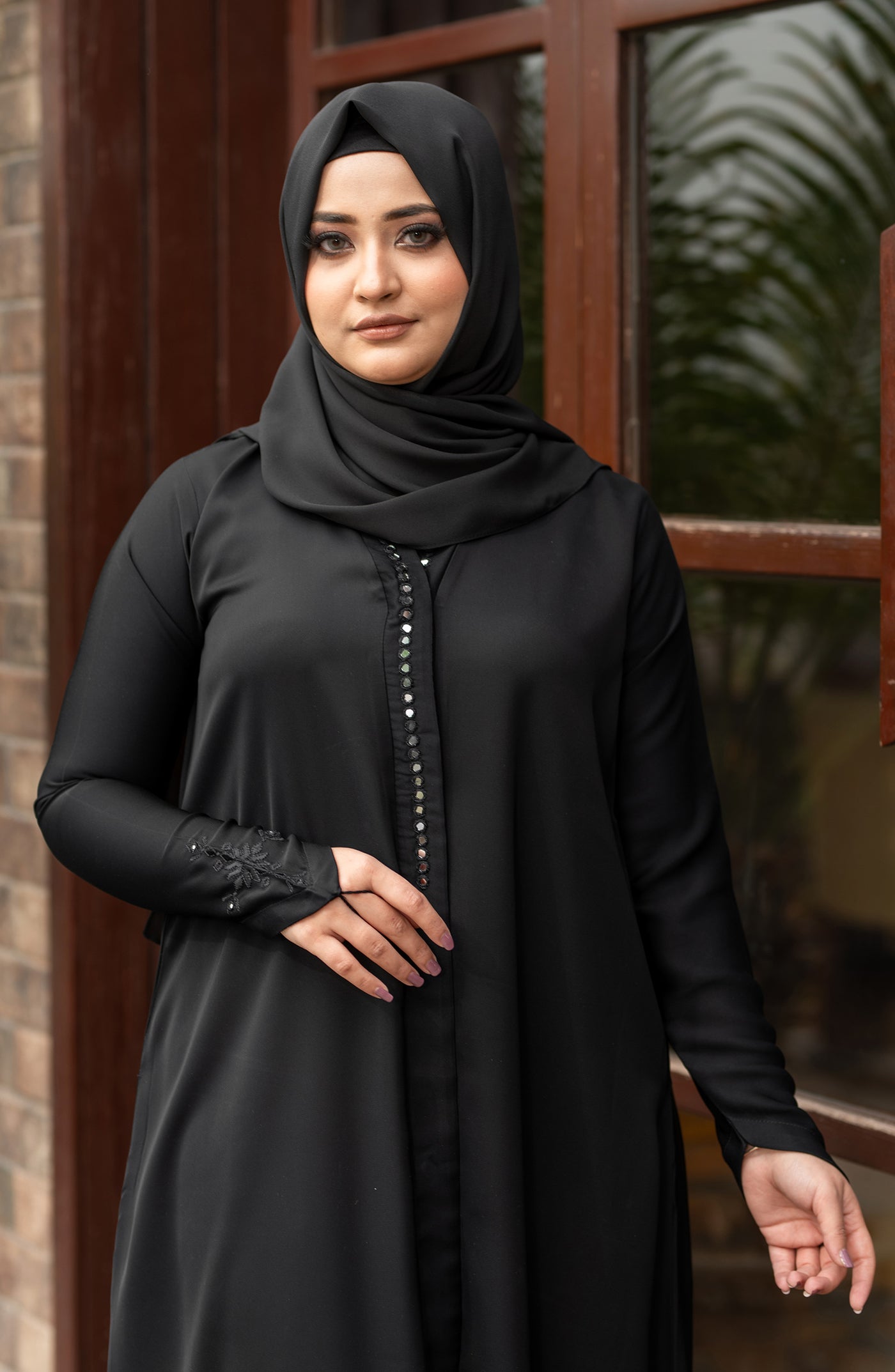 black abaya with snap button closure
