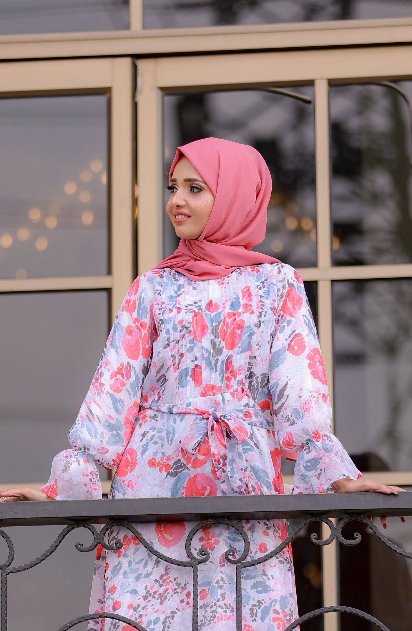 women with abstract white floral maxi dress & pink hijab