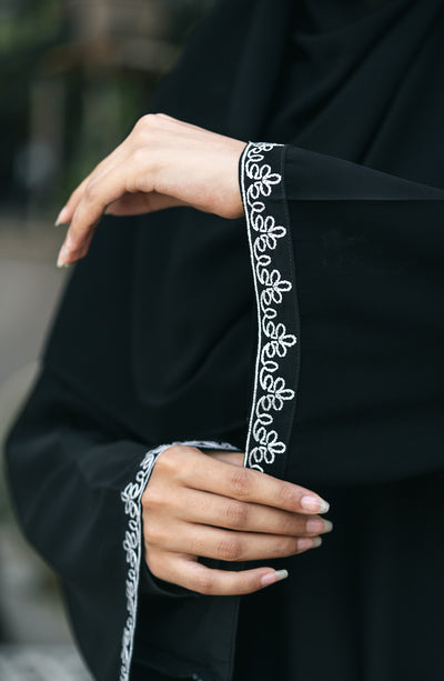 black kimono with embroidery on hem of the sleeves