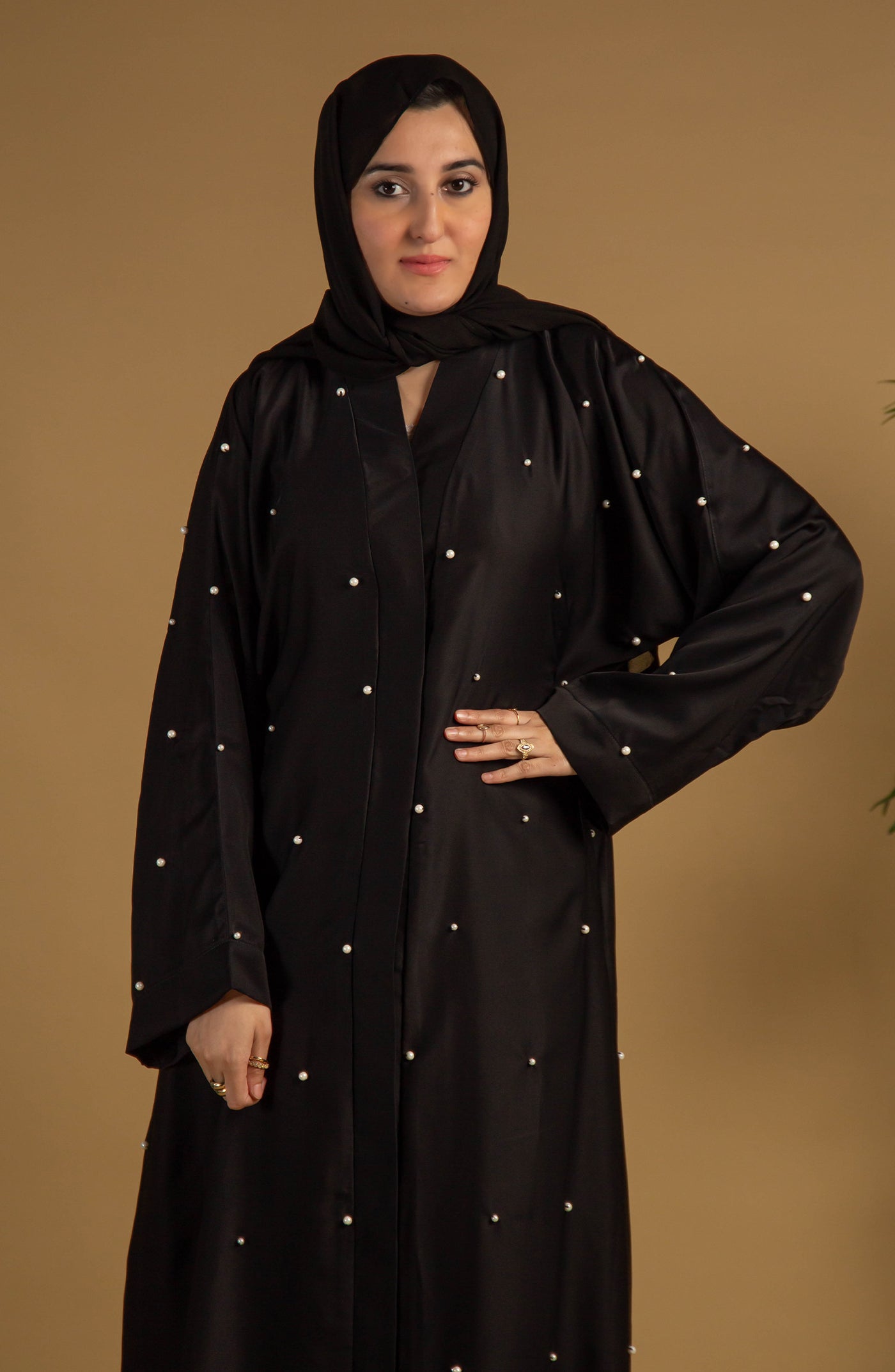 women with pearl black front open abaya and black hijab