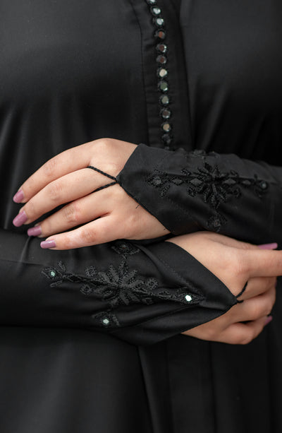 black embroidered abaya with foil work on neckline