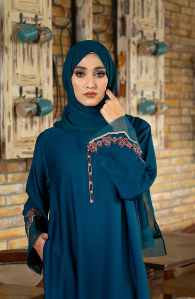 women with embroidered abaya in zinc color