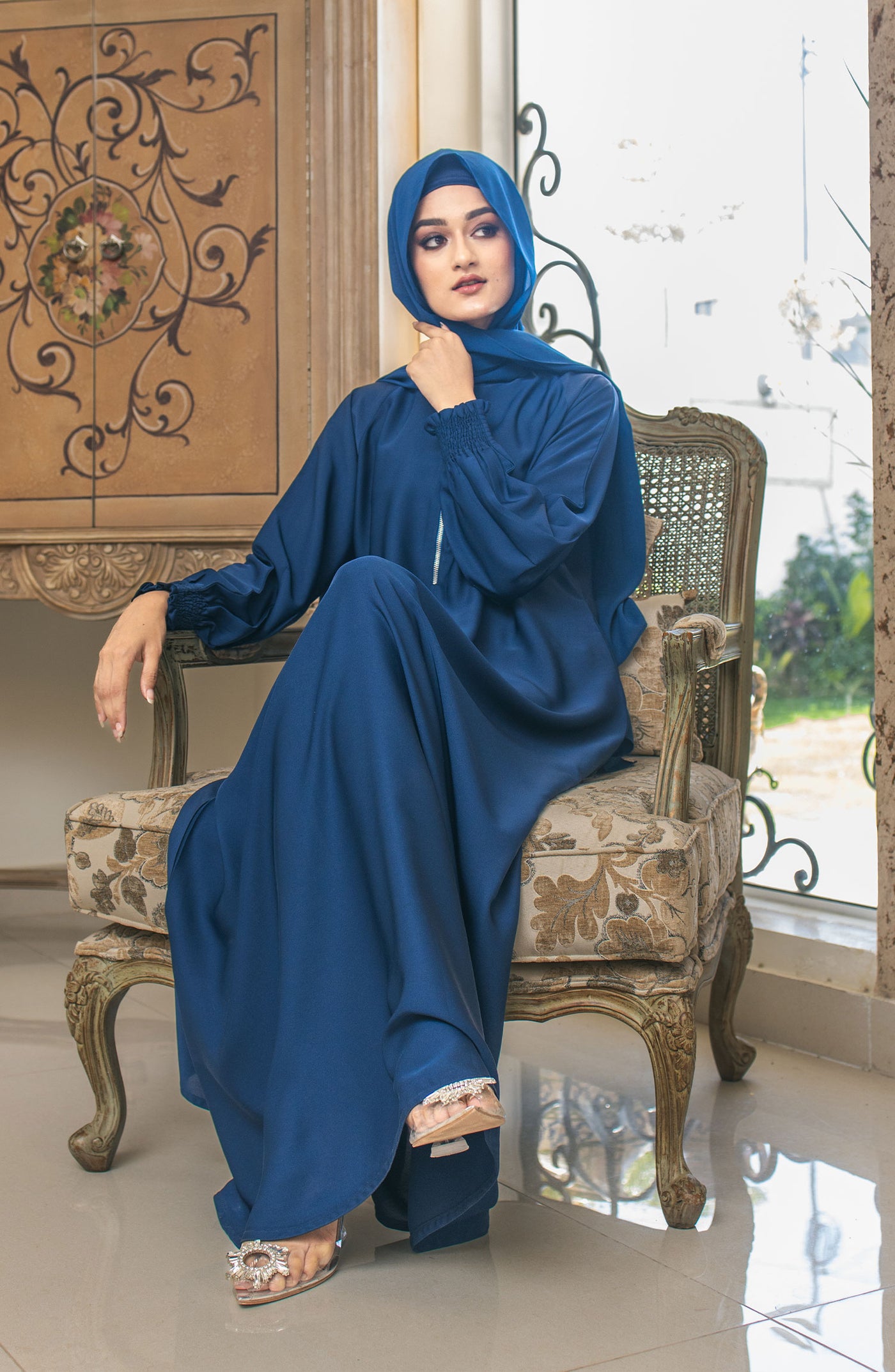 women with blue colour chiffon abaya and hijab