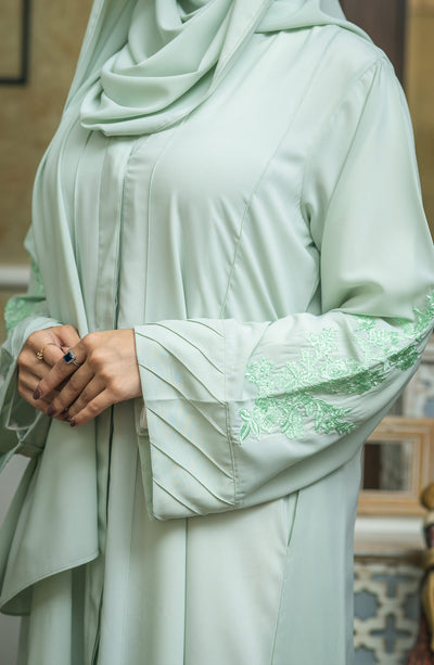 mint chiffon abaya with snap button closure