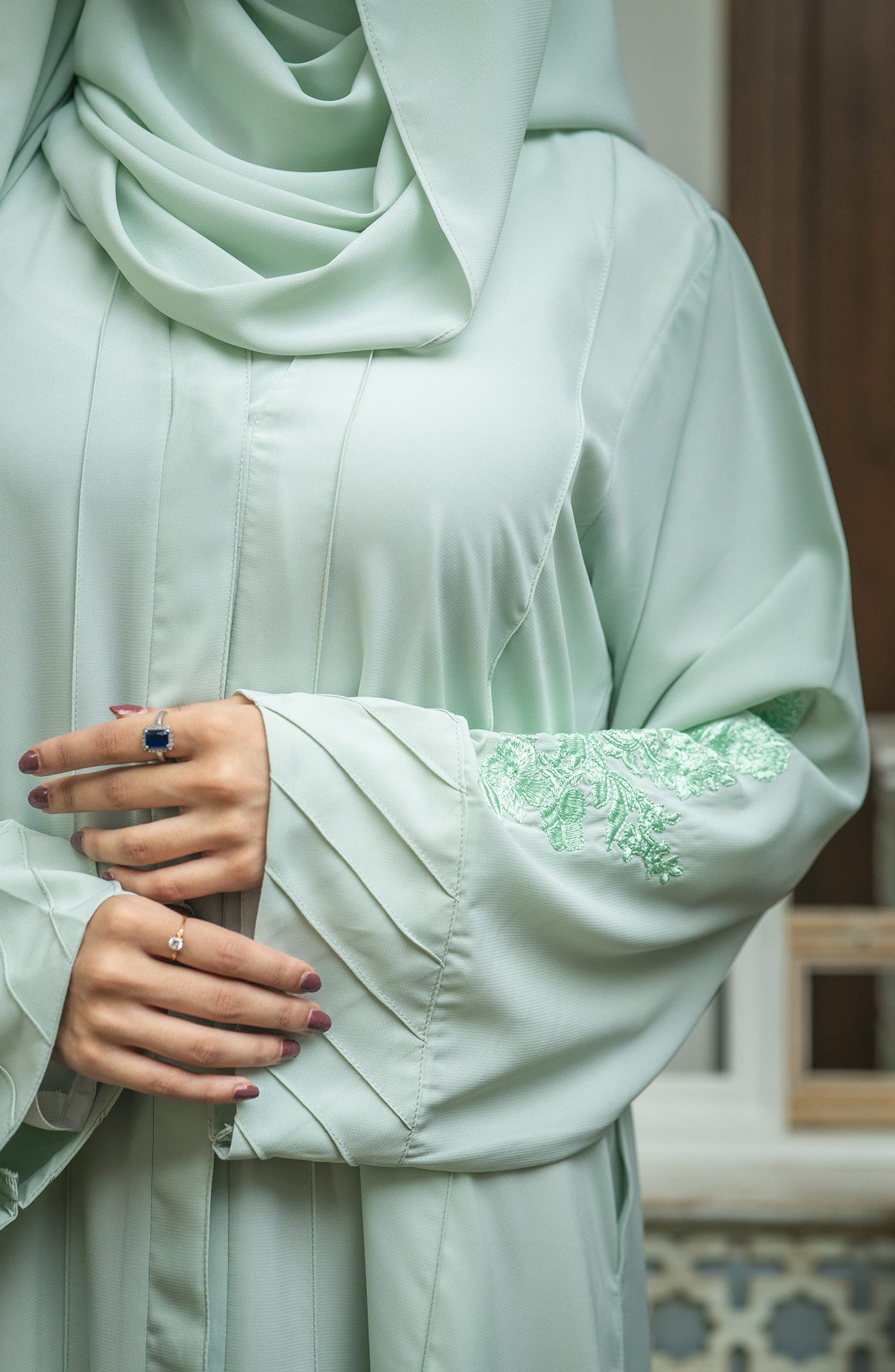 mint abaya with pin tucks on sleeves hem