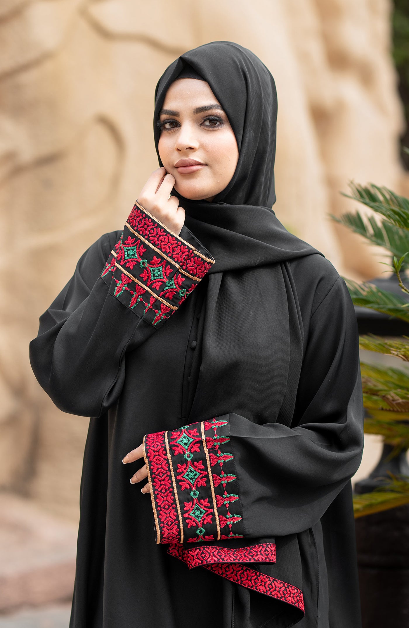 black closed abaya with round neckline placket
