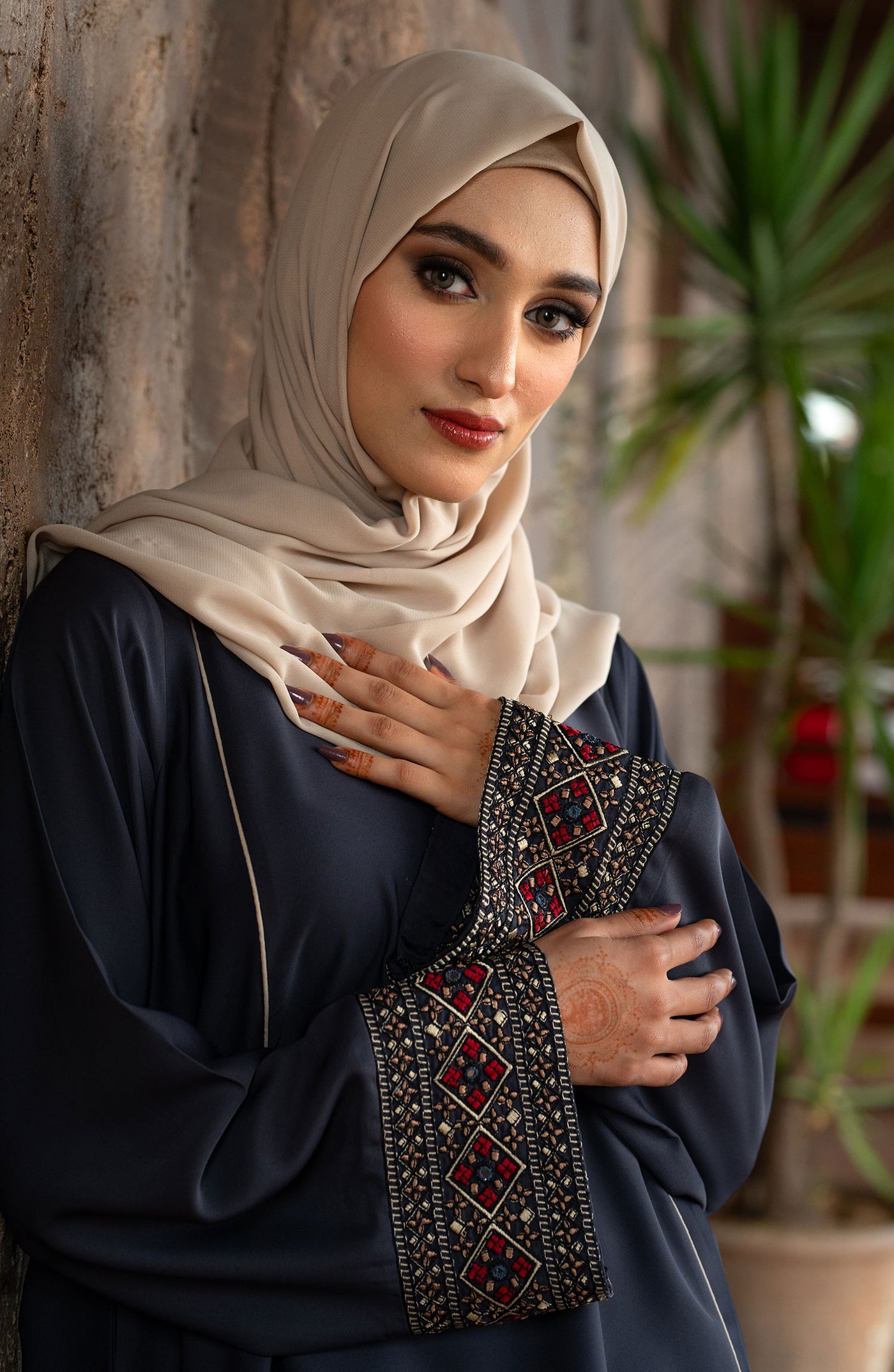 lady with charcoal grey embroidered abaya & hijab